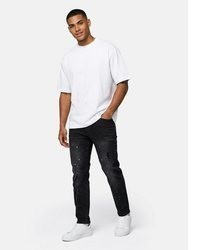 schwarze Jeans mit Destroyed-Effekten von Tazzio
