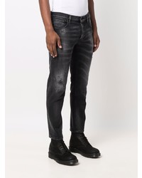 schwarze Jeans mit Destroyed-Effekten von Dondup