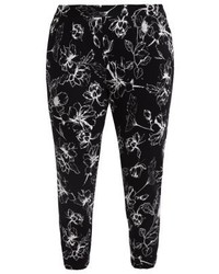 schwarze Karottenhose mit Blumenmuster von Evans