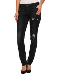 schwarze enge Jeans aus Leder mit Destroyed-Effekten
