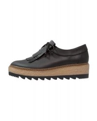 schwarze Leder plateau Slippers von Tamaris