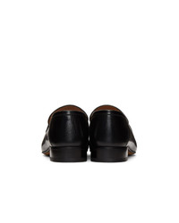 schwarze Leder Slipper von Gucci