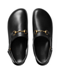 schwarze Leder Slipper von Gucci