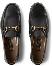 schwarze Leder Slipper von Gucci