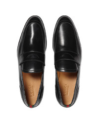 schwarze Leder Slipper von Gucci