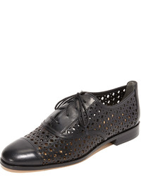 schwarze Oxford Schuhe mit geometrischem Muster