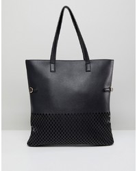 schwarze Shopper Tasche aus Leder mit Ausschnitten von Qupid
