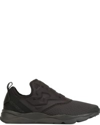 schwarze Slip-On Sneakers mit geometrischem Muster von Reebok