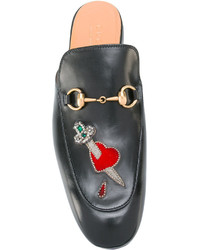 schwarze Slipper von Gucci