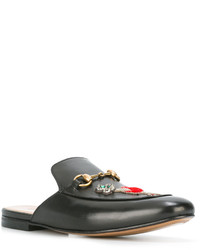 schwarze Slipper von Gucci