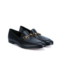 schwarze Slipper von Gucci