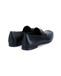 schwarze Slipper von Gucci