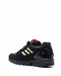 schwarze Sportschuhe von adidas