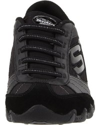 schwarze Turnschuhe von Skechers