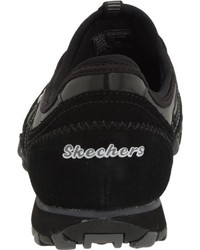 schwarze Turnschuhe von Skechers