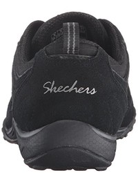 schwarze Turnschuhe von Skechers