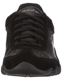 schwarze Turnschuhe von Skechers