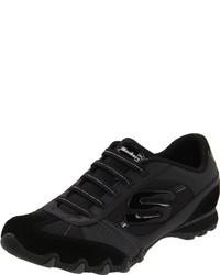 schwarze Turnschuhe von Skechers