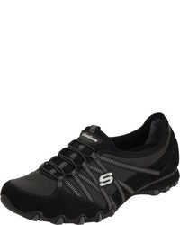 schwarze Turnschuhe von Skechers