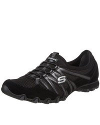 schwarze Turnschuhe von Skechers