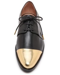 schwarze und goldene Leder Oxford Schuhe von Thakoon