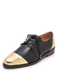 schwarze und goldene Leder Oxford Schuhe von Thakoon