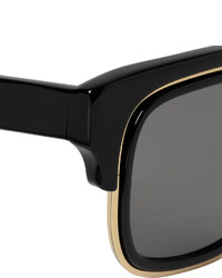 schwarze und goldene Sonnenbrille
