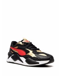 schwarze und goldene Sportschuhe von Puma