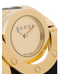 schwarze und goldene Uhr von Gucci