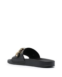 schwarze und goldene verzierte Ledersandalen von Moschino