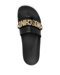 schwarze und goldene verzierte Ledersandalen von Moschino