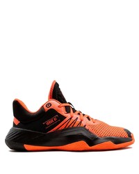 schwarze und orange Sportschuhe von adidas