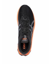 schwarze und orange Sportschuhe von Asics