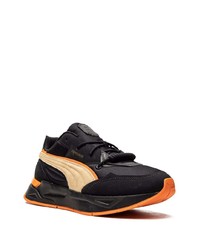 schwarze und orange Sportschuhe von Puma