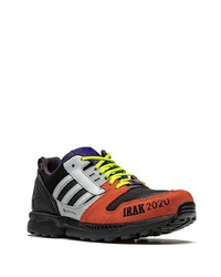 schwarze und orange Sportschuhe von adidas