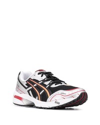 schwarze und silberne Sportschuhe von Asics