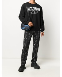 schwarze und weiße bedruckte enge Jeans von Moschino