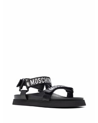 schwarze und weiße bedruckte Ledersandalen von Moschino