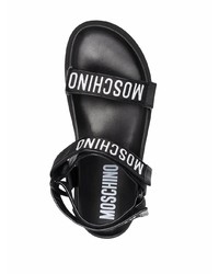 schwarze und weiße bedruckte Ledersandalen von Moschino