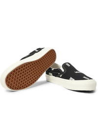 schwarze und weiße bedruckte Slip-On Sneakers aus Segeltuch von Vans