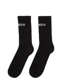 schwarze und weiße bedruckte Socken von Axel Arigato