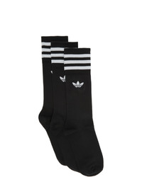 schwarze und weiße bedruckte Socken von adidas Originals
