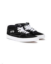 schwarze und weiße hohe Sneakers aus Segeltuch von Vans