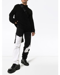 schwarze und weiße Jeans mit Destroyed-Effekten von Raf Simons