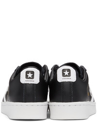 schwarze und weiße Leder niedrige Sneakers mit Sternenmuster von Converse