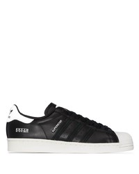 schwarze und weiße Leder niedrige Sneakers von adidas