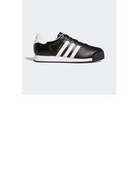 schwarze und weiße Leder niedrige Sneakers von adidas Originals