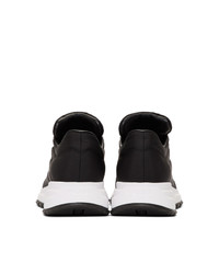 schwarze und weiße Leder niedrige Sneakers von Prada