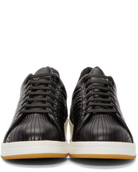 schwarze und weiße Leder niedrige Sneakers von Alexander McQueen