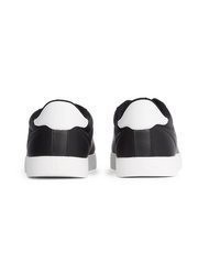 schwarze und weiße Leder niedrige Sneakers von Calvin Klein Jeans